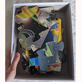 Solar system M & D open box with hand showing puzzle pieces