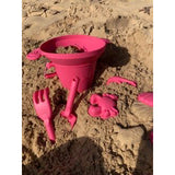 Scrunch Sand Moulds - Strawberry Red (Footprints Set), also visible on beach is paneer, bucket and beach tools