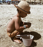 Scrunch bucket beach shot with boy in hat