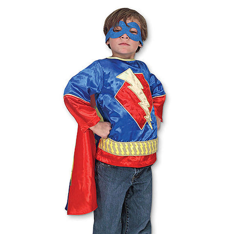 Boy wearing superhero costume 