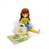 Planet Rescuer Lottie Doll, unboxed, sitting with bag and guide
