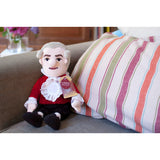 Mozart - Little Thinker Doll With Musical Box, lifestyle shop sitting on sofa with striped cushion