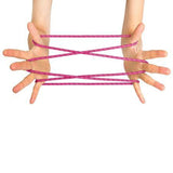 Cat's cradle in pink, demonstrated on hands 