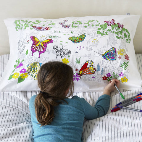 Doodle Butterfly Pillowcase, girl colouring with pens