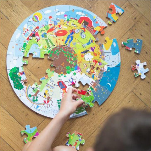 Four Seasons - Circular Puzzle, lifestyle being completed by child 