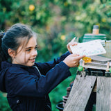 Flower Press, girl using press in garden 