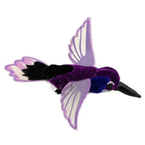Purple hummingbird finger puppet stock image