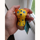 Jaguar Maraca, with label, held in adult hand