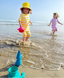 Scrunch crocodile jug blue sky, children in sea 