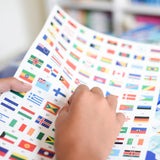 Poppik Poster & Stickers - Flags Of The World, child's hand peeling off sticker