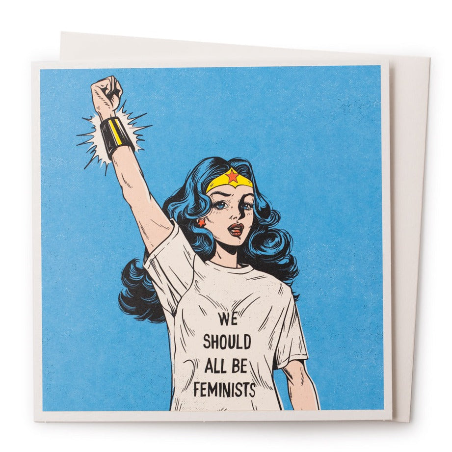 Feminist greeting card with envelope visible behind 