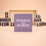 Women Who Dared Blocks, purple block at front, with tray and other blocks behind 
