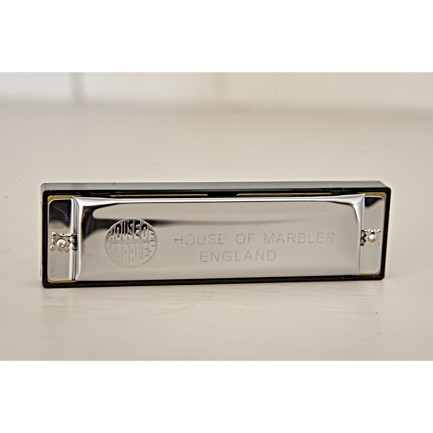 Harmonica, unboxed, standing up to show imprint