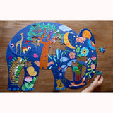 Elephant Puzzle by Djeco, being completed, child's hand for scale