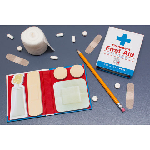 Document First Aid sticky notes, lifestyle shot with props