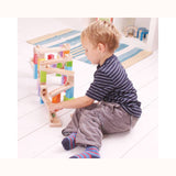 Little boy playing with bigjigs marble run 