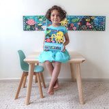 Poppik Panoramic Poster & Stickers - Aquarium, girl with pack in front of poster on wall 