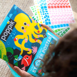 Poppik Panoramic Poster & Stickers - Aquarium, child holding pack and stickers shown 