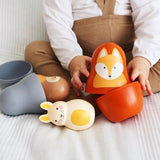 Woodland Nesting Friends (with chiming Bengi Bunny)  lifestyle child hands playing with nesting toy                  