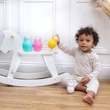 Rainbow Nesting Babies (with chiming Bo Bunny) child playing with set by rocking horse